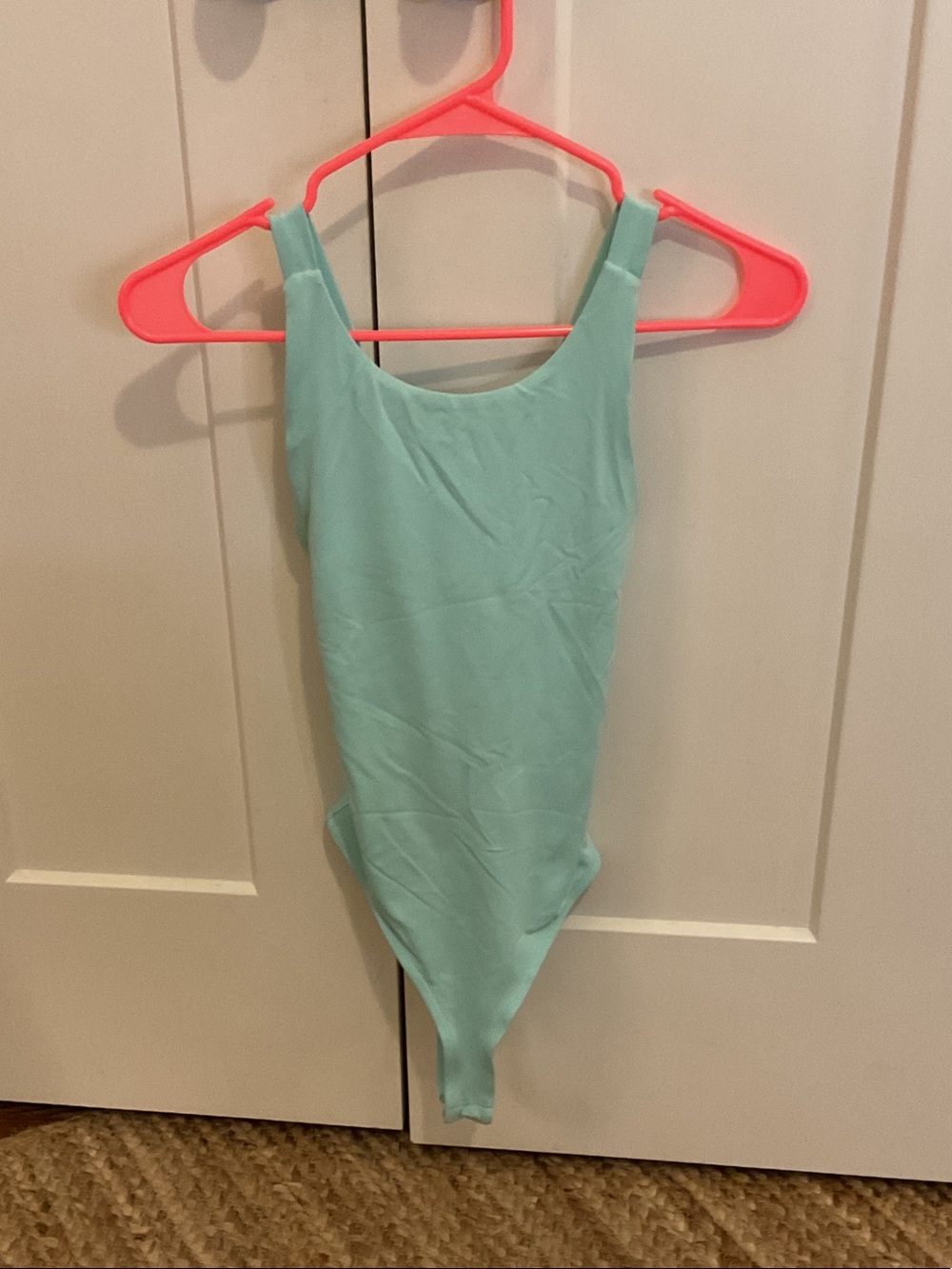 Women’s Solid Light Aqua One-Piece Bodysuit Francesca’s